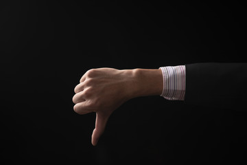 hand of businessman emotion on black background