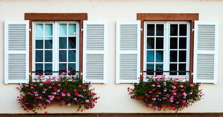 Fototapeta na wymiar Classic old windows in timber-framing building, Alsace