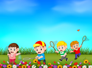 Cartoon kids catching butterfly in the garden