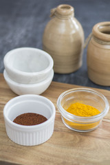 turmeric and chili powder on table top to use for meal prep