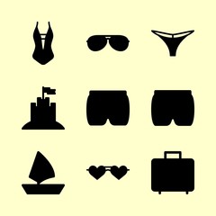 beach vector icons set. sunglasses, thong, suitcase and swimsuit in this set
