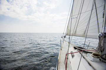 Pure morning light over he Baltic sea. A view from the sailboat's deck to the bow, Estonia