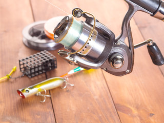 Spinning reel on the background of fishing gear. Close-up