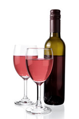Red wine in glass and bottle isolated on white background.