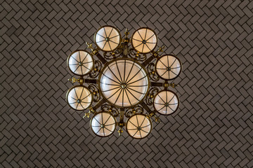 Tiles and lamp in the celling of Ellis island registry room