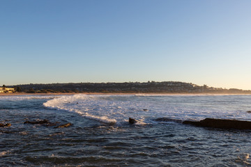 Low tide view of Sydney beach coastline.