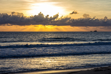 Fototapeta premium Waves on the beach at sunset