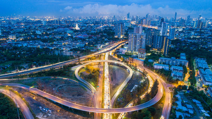 Fototapeta na wymiar Aerial view highway road intersection at dusk for transportation, distribution or traffic background.