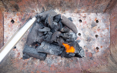 Burning charcoal firewood in the stove