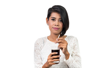 Beautiful asian woman with glass of cola. Studio shot