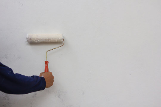 Man Asian Happy Woman Painting Interior Wall With Paint Roller In New House
