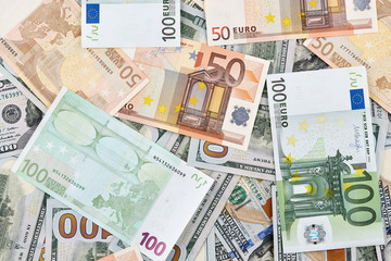 A lot of euro and american dollars banknotes. Background
