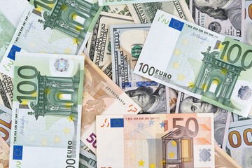 A lot of euro and american dollars banknotes. Background