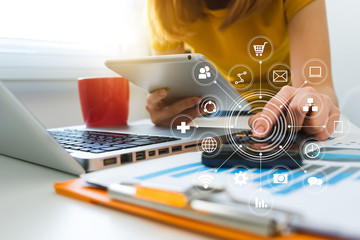 businessman hand working with finances about cost and calculator and laptop with tablet on withe desk with VR chart  at office in morning light