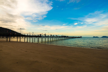 Fototapeta premium Wooden bridge on sea beach sunrise colorful sky