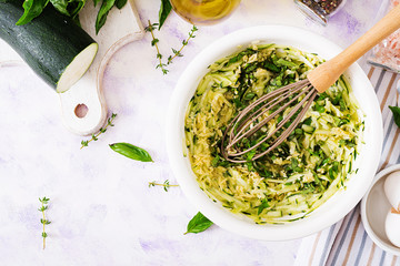 Ingredients for cooking frittata with zucchini, cheese and basil. Useful breakfast. Italian...