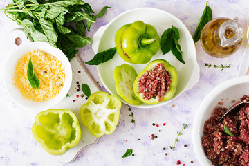 Ingredients for preparation of stuffed pepper with minced meat and buckwheat porridge. Tasty food. Flat lay. Top view