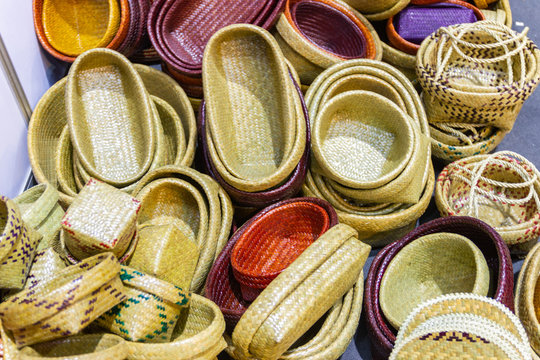 Close-up Community Products Weaving A Wicker Basket By Handmade, in a market of Thailand  