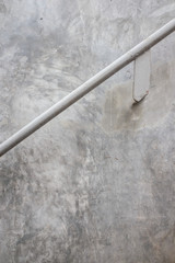 Metal handrail with loft concrete background