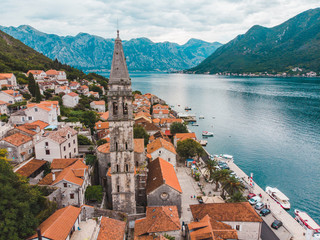 aerial view of old european city with sea and mountains in background