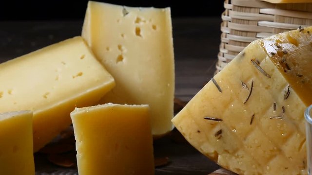 Restaurant dish serving. Close up shot of cheese and walnut on wooden background.