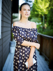 Outdoor atmospheric fashion photo of young beautiful lady