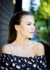 Outdoor atmospheric fashion photo of young beautiful lady