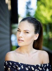 Outdoor atmospheric fashion photo of young beautiful lady