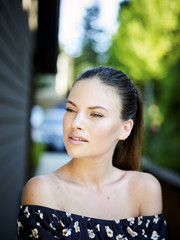 Outdoor atmospheric fashion photo of young beautiful lady