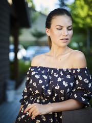 Outdoor atmospheric fashion photo of young beautiful lady