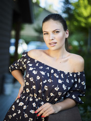 Outdoor atmospheric fashion photo of young beautiful lady