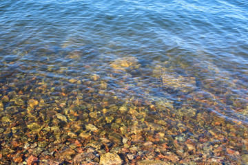 Fototapeta na wymiar Defocus Natural abstract background of sea pebbles water .