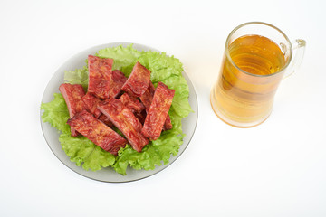 Grilled pork ribs and beer isolated on white background