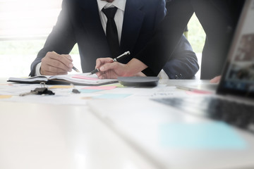 Cropped shit business people meeting on table.