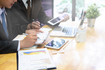 Two Businessman consult financial report with a consulting meeting.