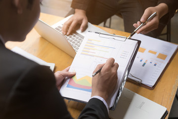 Two Businessman consult financial report with a consulting meeting.