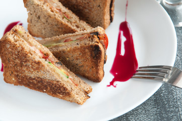  Sandwiches of triangular shape. With cheese, cucumbers, basil and tomatoes.