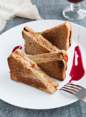  Sandwiches of triangular shape. With cheese, cucumbers, basil and tomatoes.