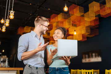 Opening restaurant. Beaming married couple feeling extremely happy and successful after opening their restaurant