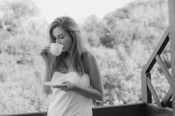 European woman drinking coffee in the morning breakfast in bedroom fresh start the day happiness relax at home healthy lifestyle concept  