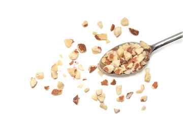 Diced Almond in a spoon on white background - isolated