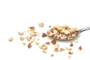 Diced Almond in a spoon on white background - isolated