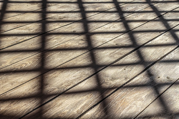 Shadow on a wooden plank floor gazebos.