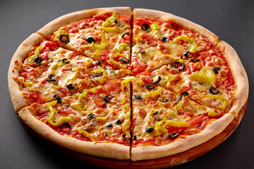 Hot pizza on black background for lunch or dinner crust. Pizza menu.