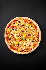 Vegetarian pizza on black background. Food background. Pizza menu