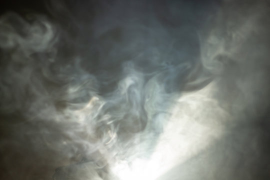 beautiful white color light beam for movie and cinema at night . smoke texture spotlight . screening abstract background .