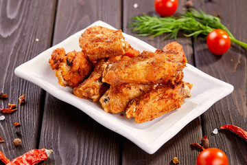 Tasty crispy chicken wings with sauce. Beer snacks