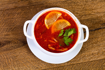 Solyanka soup with lemon