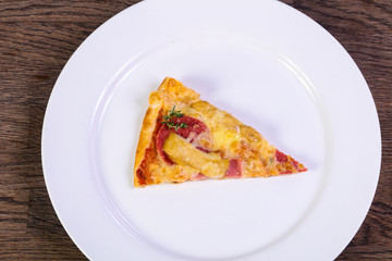 Pizza with ham and sausages