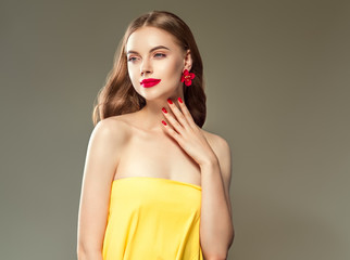 Beautiful brunette woman red lips and nails manicured beauty model girl with long hairstyle